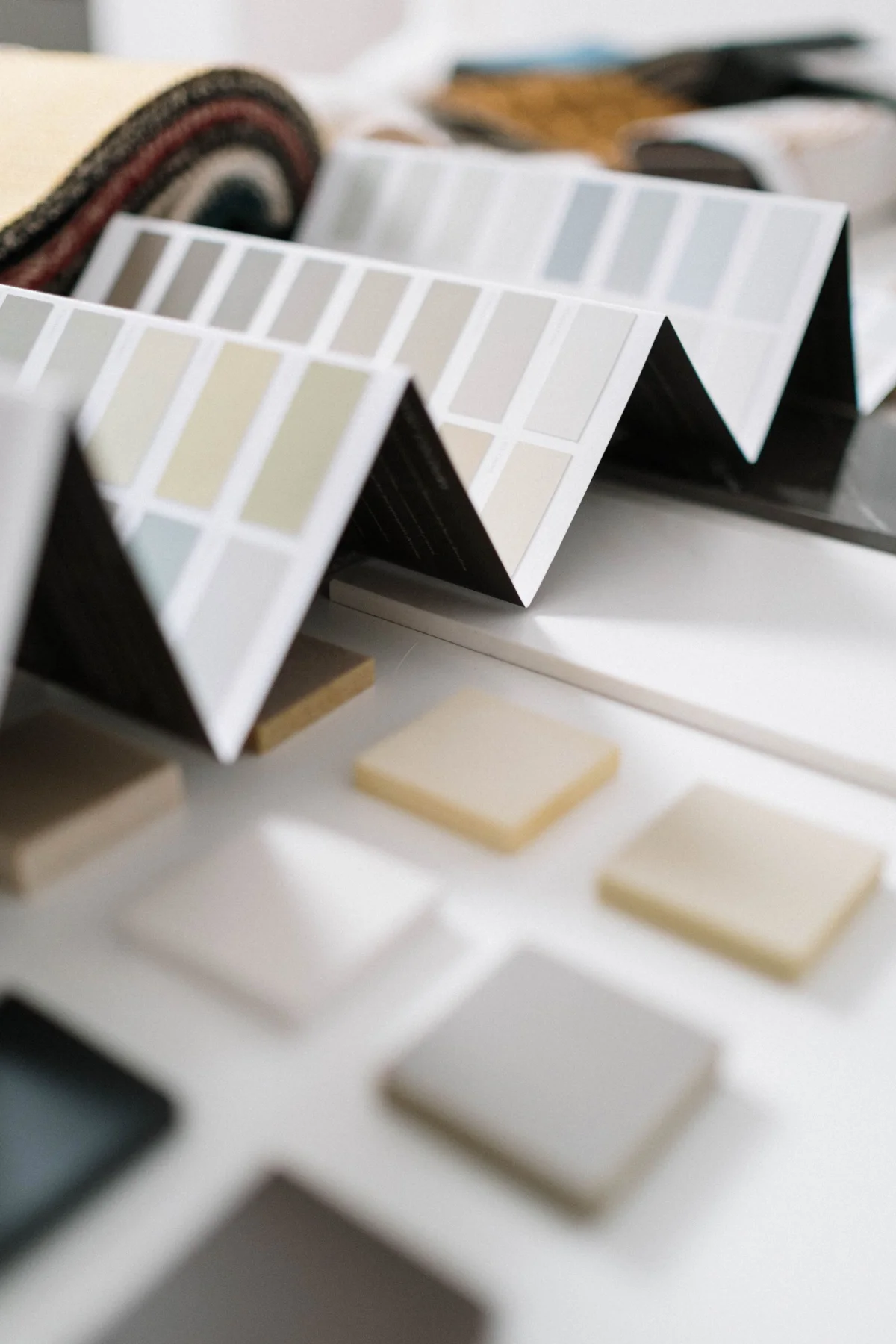 A selection of material and colour samples arranged on a work surface